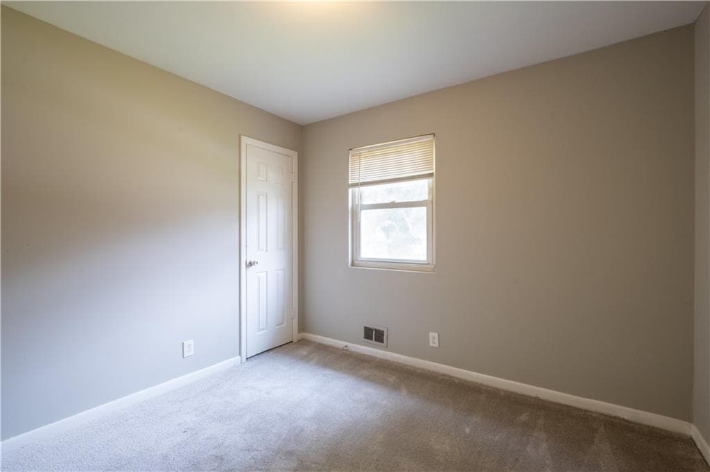4 bedroom, 2 bathroom, 1,000 sq ft single family residence for sale at 2660 Beacon Drive, Atlanta, GA 30349 — photo 7
