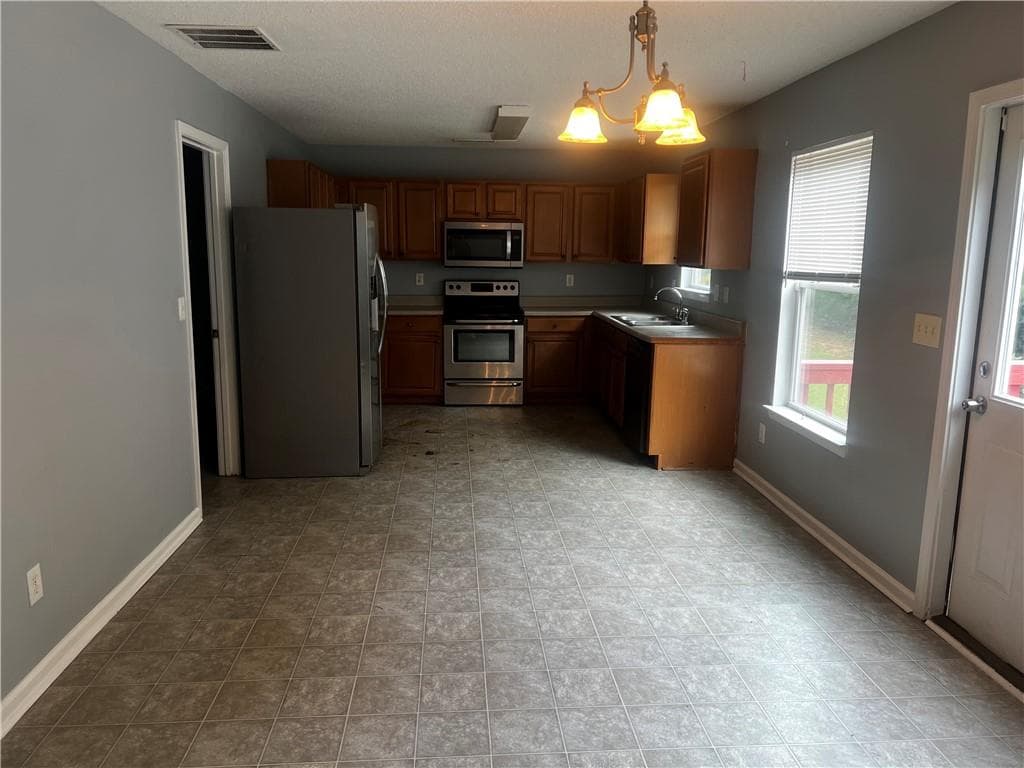 4 bedroom, 3 bathroom, 2,170 sq ft single family residence for rent at 3086 Stream View, Atlanta, GA 30349 for $2,000 a month — photo 3