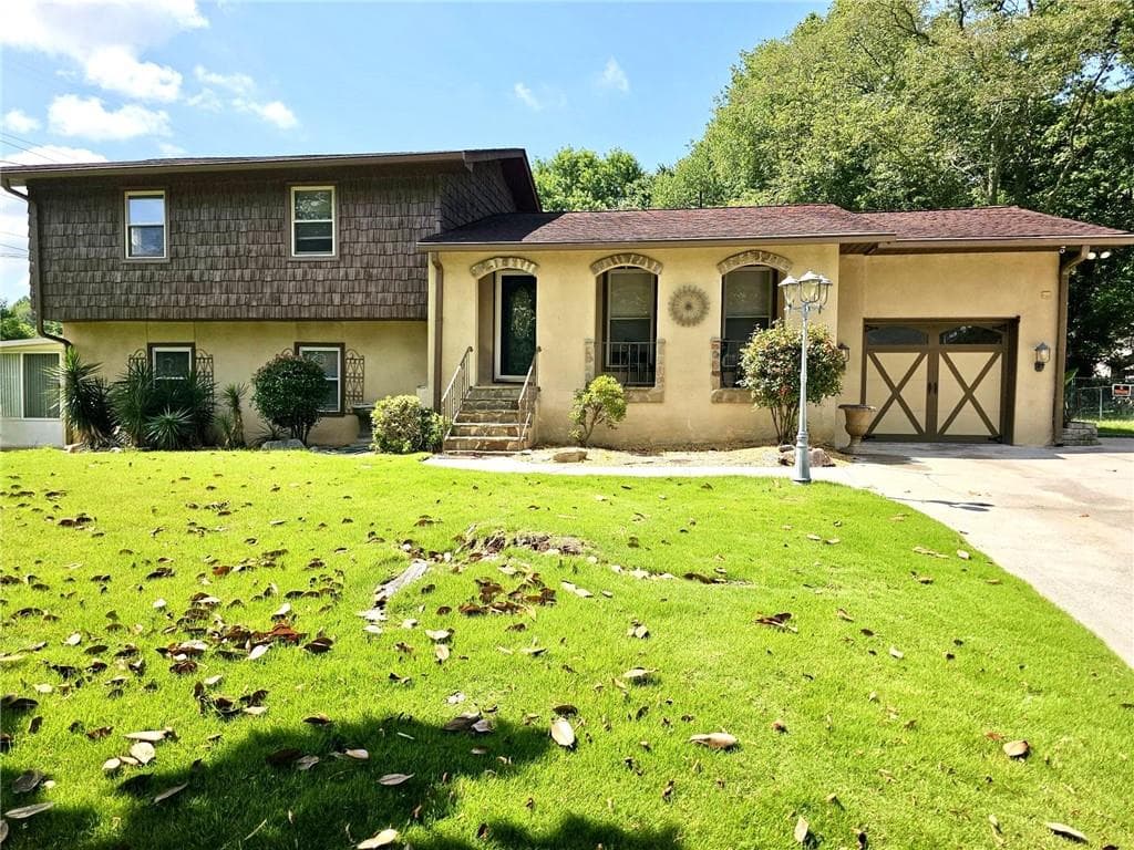 4 bedroom, 3 bathroom, 2,340 sq ft single family residence for sale at 1244 Hickory Wood Drive, Woodstock, GA 30188