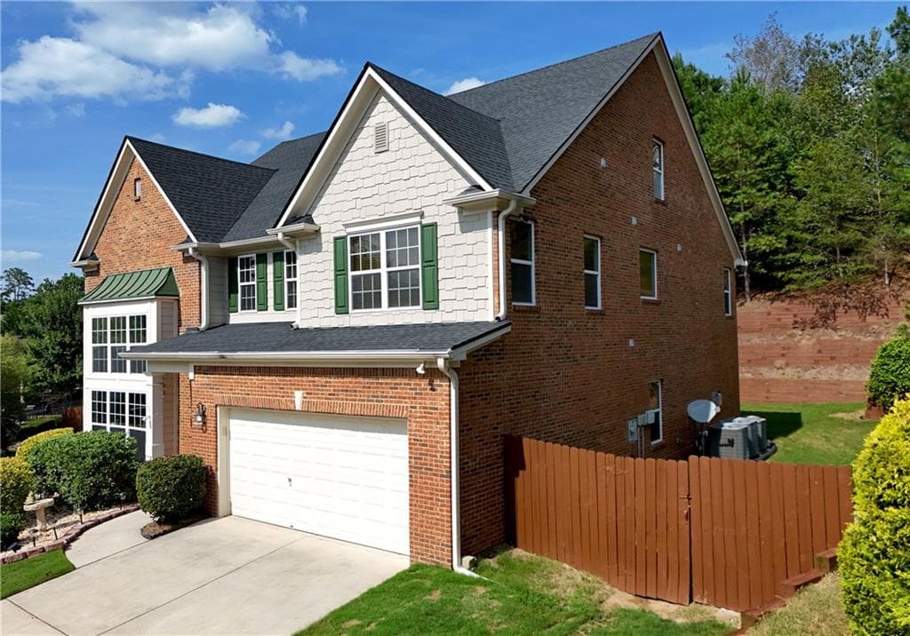 6 bedroom, 4 bathroom, 3,333 sq ft single family residence for sale at 6015 Thrasher Court, Cumming, GA 30028 — photo 2