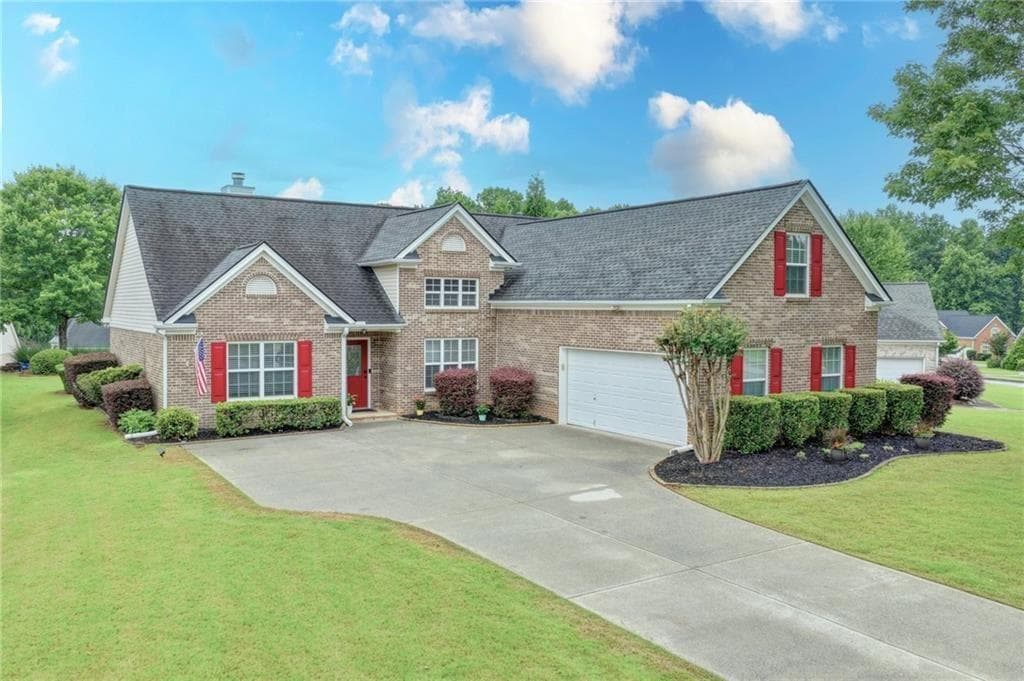 4 bedroom, 2 bathroom, 2,047 sq ft single family residence sold at 5205 Ashbury Manor Lane, Sugar Hill, GA 30518