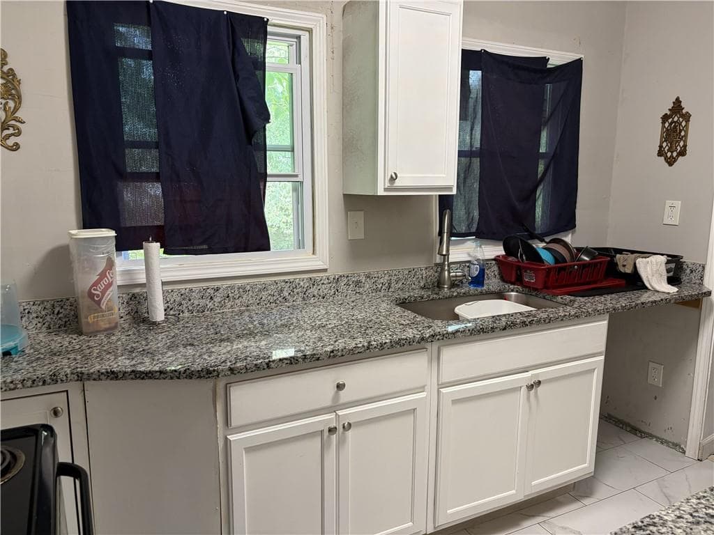 4 bedroom, 2 bathroom, 1,144 sq ft single family residence for sale at 2680 Wiggins Street, Lithonia, GA 30058 — photo 3