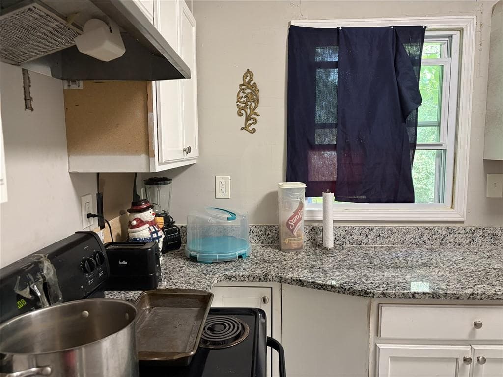4 bedroom, 2 bathroom, 1,144 sq ft single family residence for sale at 2680 Wiggins Street, Lithonia, GA 30058 — photo 4