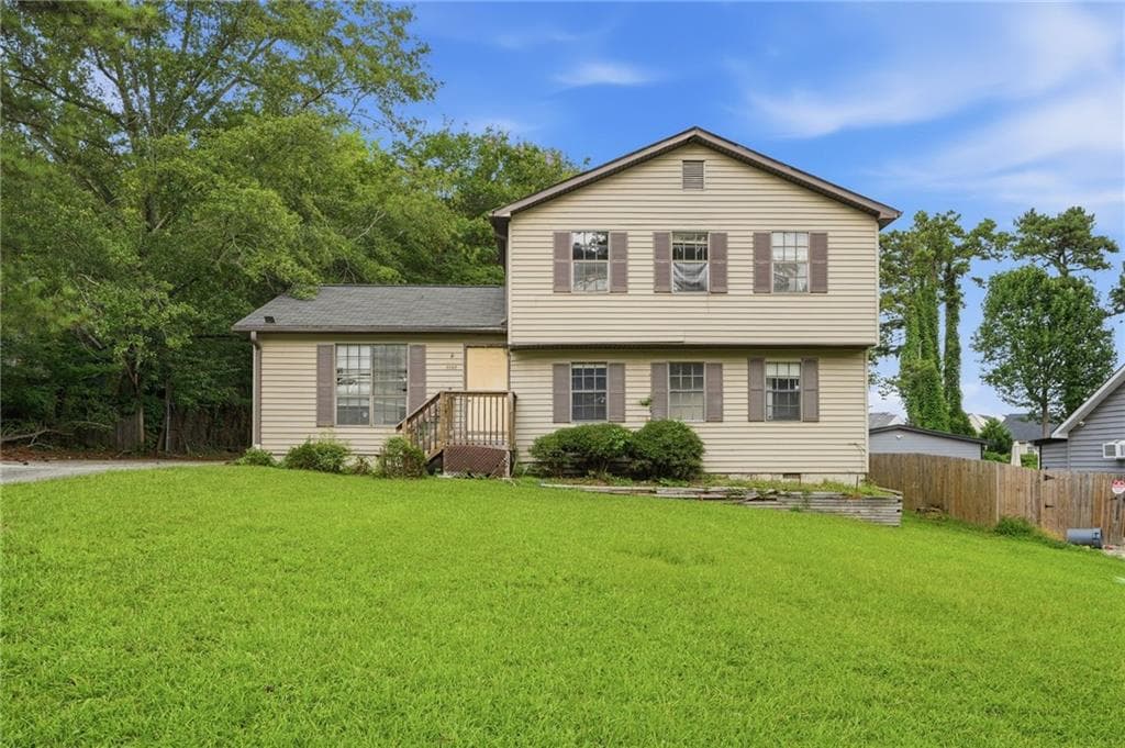 4 bedroom, 3 bathroom, 1,544 sq ft single family residence for sale at 1135 Kristen Cove, Atlanta, GA 30349 — photo 2