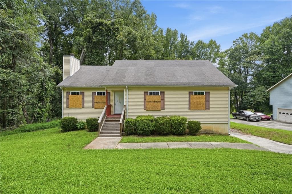 5 bedroom, 3 bathroom, 1,588 sq ft single family residence for sale at 6013 Radford Drive, Riverdale, GA 30296 — photo 1 of 35