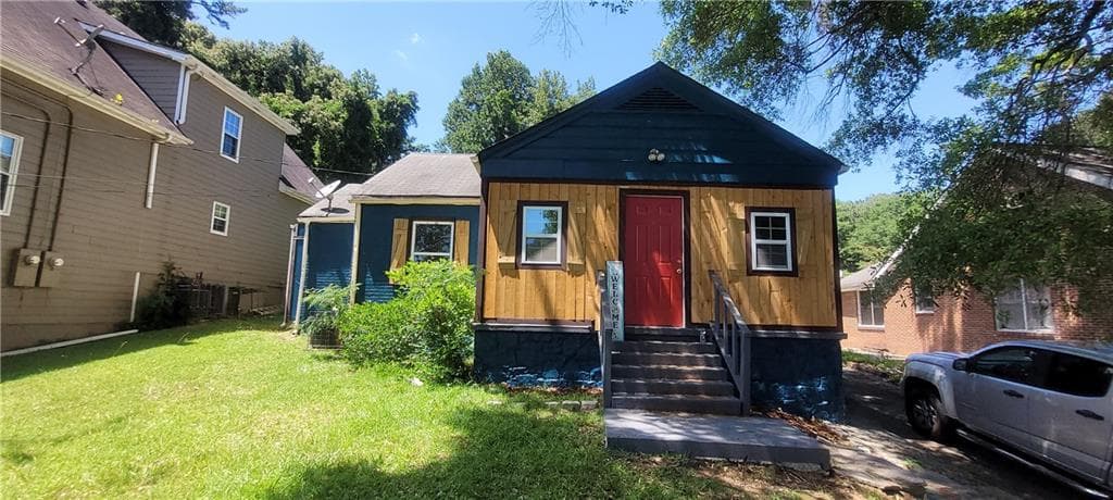 4 bedroom, 2 bathroom, 1,088 sq ft single family residence for sale at 2009 Baker Road, Atlanta, GA 30318 — photo 1 of 24
