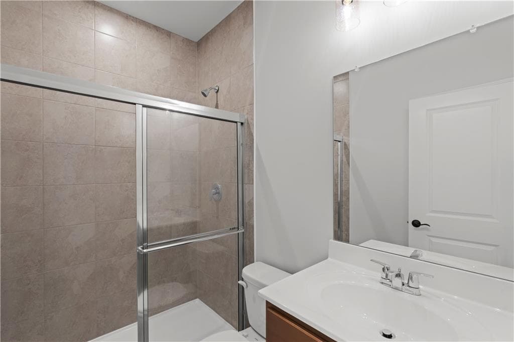 6 bedroom, 4 bathroom, 3,230 sq ft single family residence for sale at 7271 Thistle Down Way, Flowery Branch, GA 30542 — photo 9