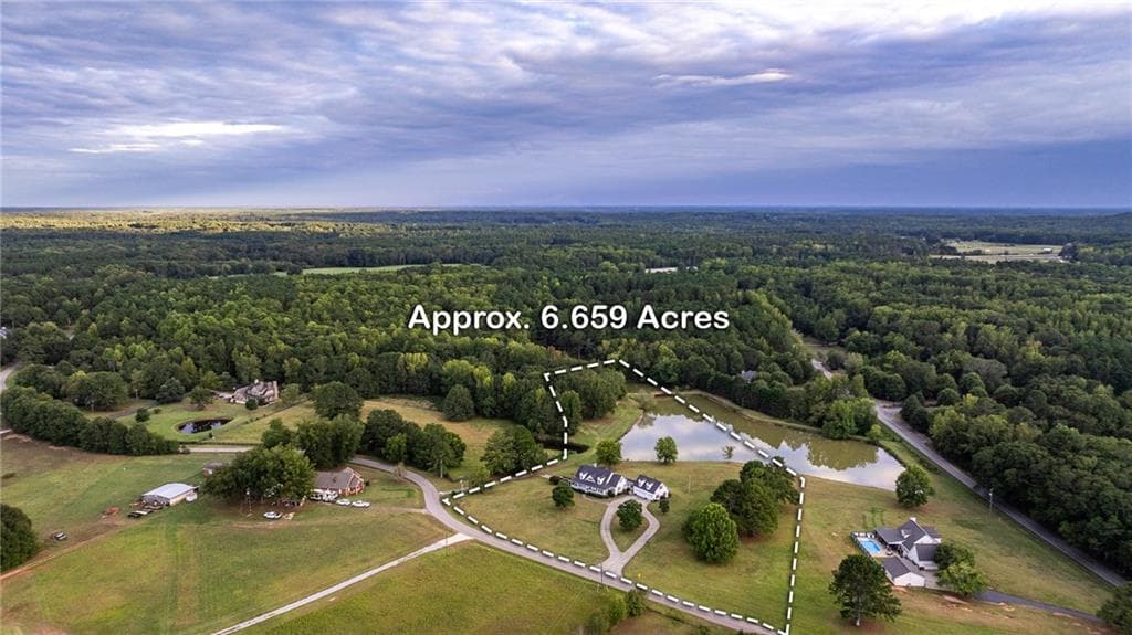 5 bedroom, 4 bathroom, 5,602 sq ft single family residence for sale at 1058 Snip Dillard Road, Monroe, GA 30656 — photo 3