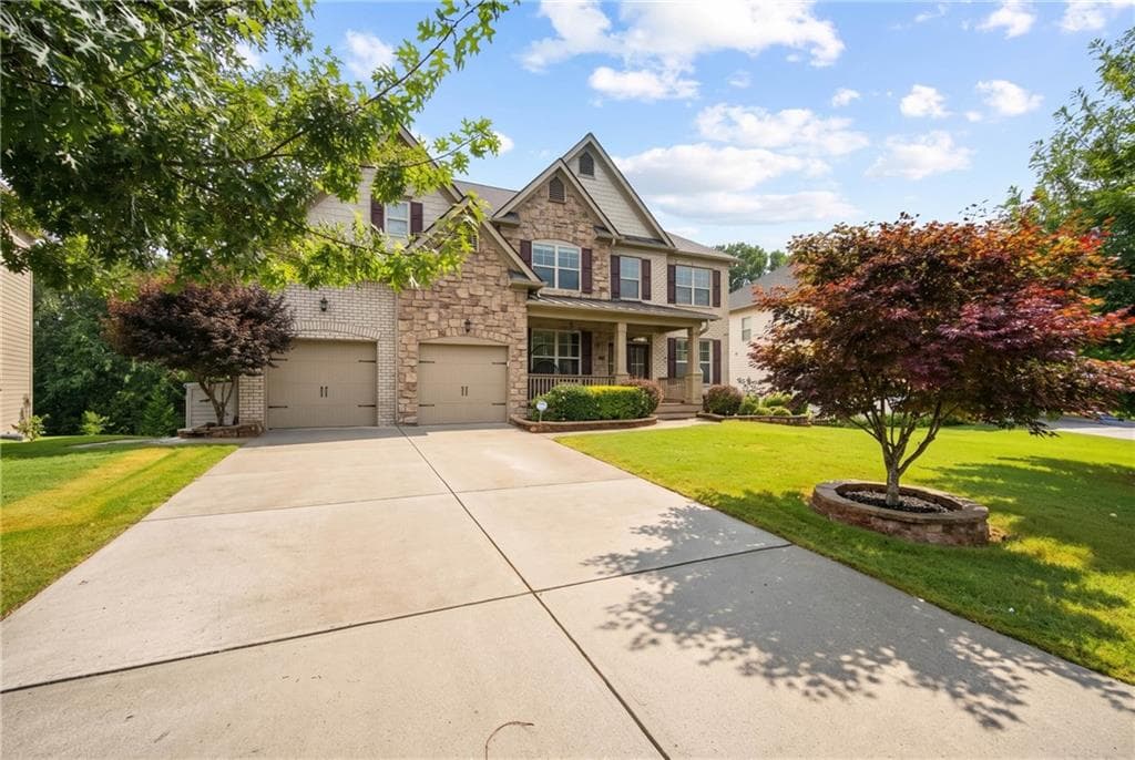 7 bedroom, 5 bathroom, 6,100 sq ft single family residence for sale at 4090 Tobiano Trail, Cumming, GA 30040 — photo 3