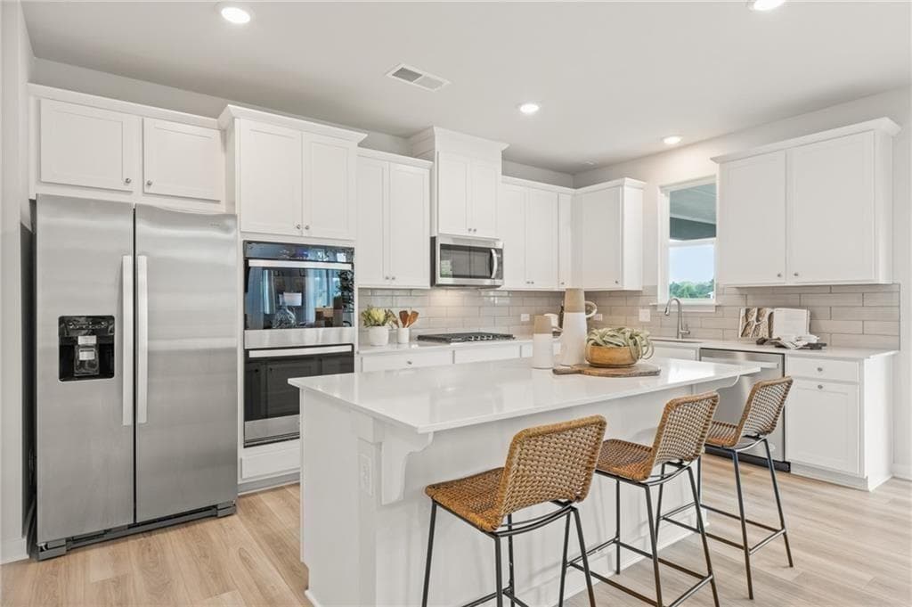 4 bedroom, 3 bathroom, 3,072 sq ft single family residence for sale at 8565 Oak Hollow Way, Cumming, GA 30041 — photo 6