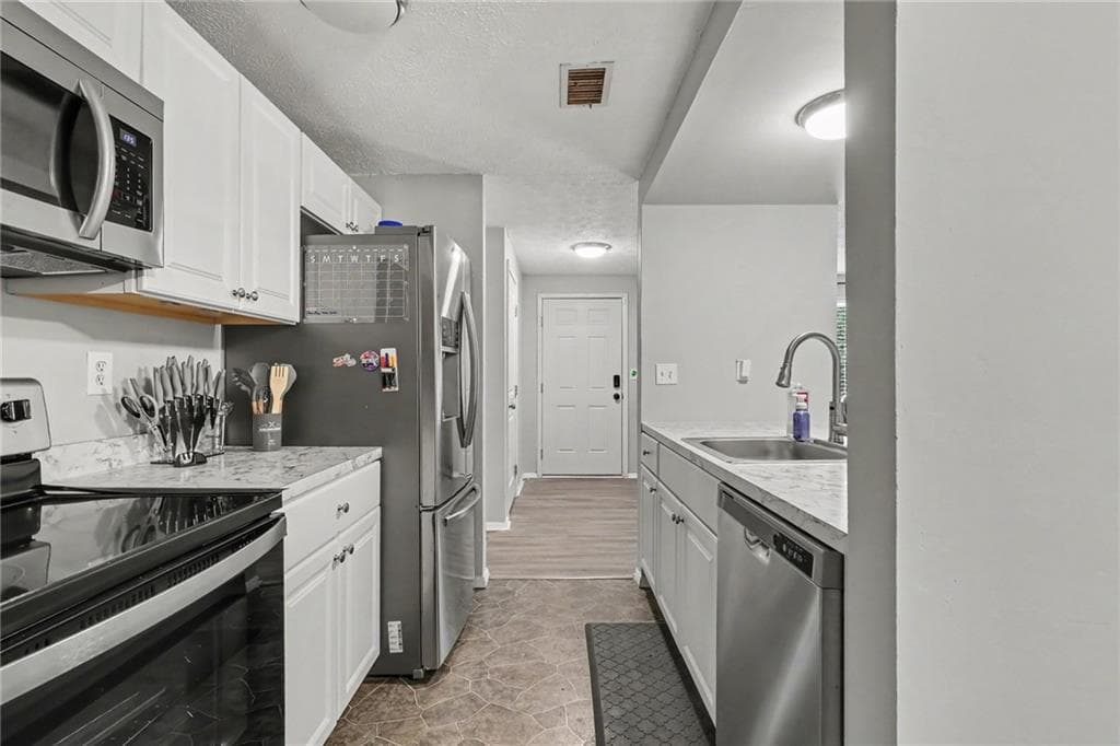 3 bedroom, 2 bathroom, 1,562 sq ft single family residence for sale at 3286 Tasman Court, Lithonia, GA 30038 — photo 10