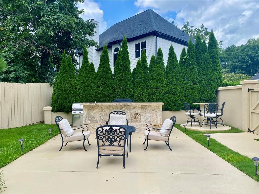 5 bedroom, 4 bathroom, 4,971 sq ft single family residence for sale at 10295 Groomsbridge Road, Johns Creek, GA 30022 — photo 5