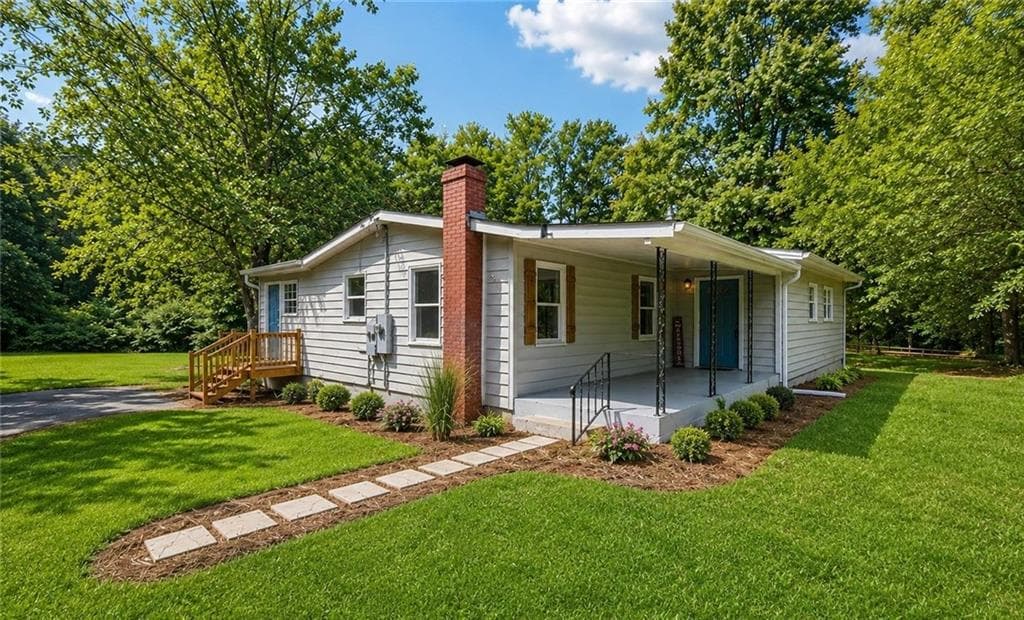 4 bedroom, 2 bathroom, 1,424 sq ft single family residence for sale at 309 Cowan Road, Conyers, GA 30094 — photo 1 of 20