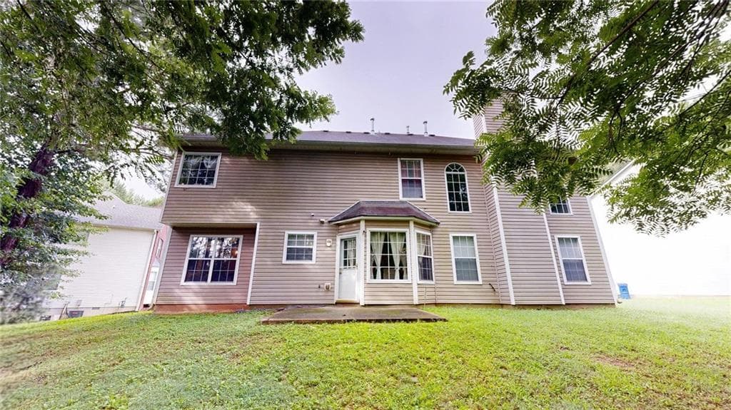4 bedroom, 3 bathroom, 2,605 sq ft single family residence for sale at 5613 Winchester Place, Lithonia, GA 30038 — photo 3