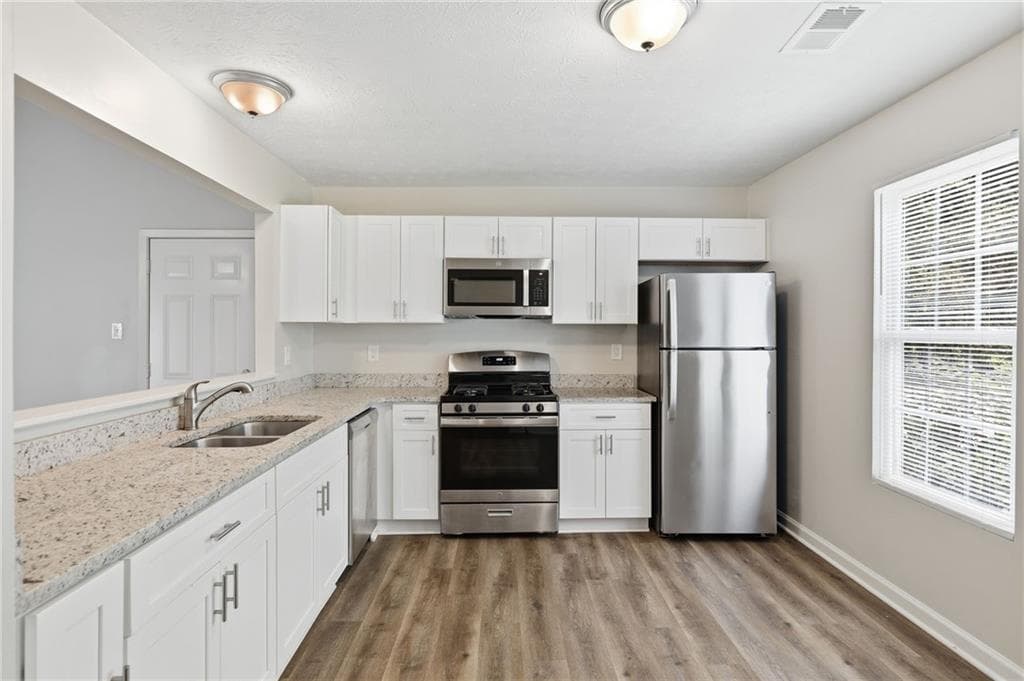 3 bedroom, 2 bathroom, 1,200 sq ft single family residence for sale at 1193 Harvest Dale Court, Stone Mountain, GA 30088 — photo 9