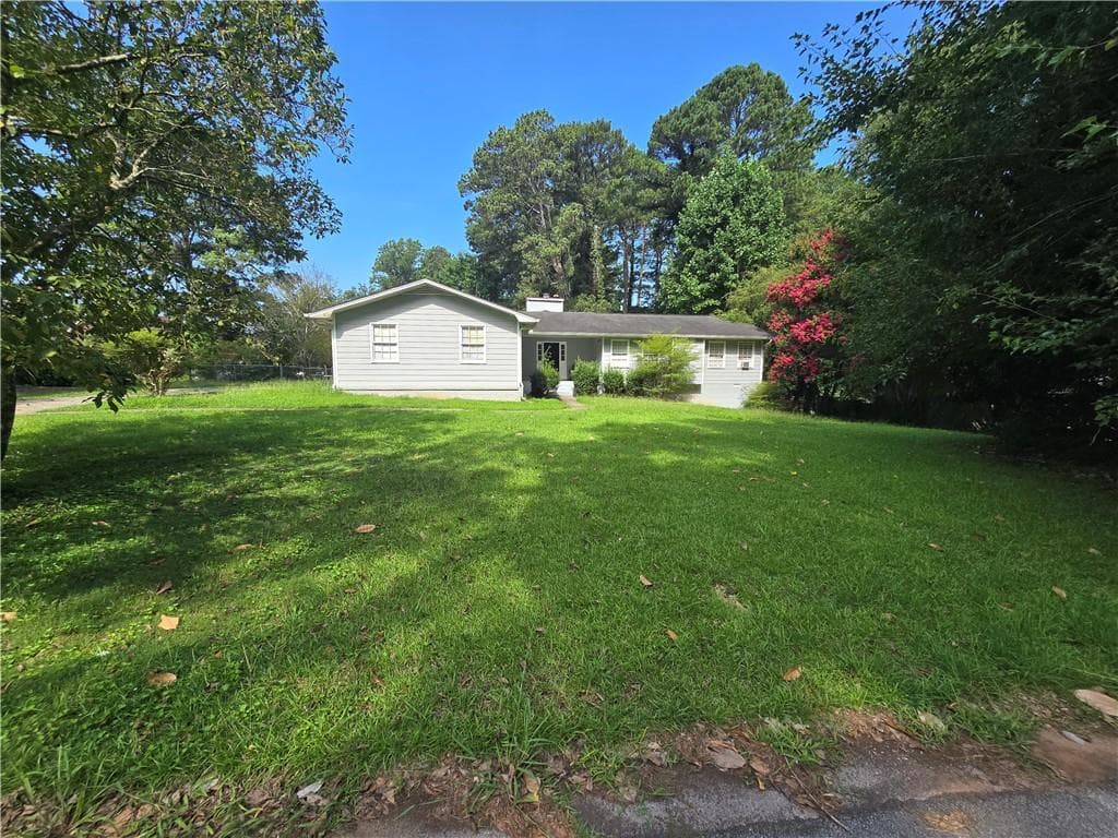 4 bedroom, 3 bathroom, 1,852 sq ft single family residence for sale at 1481 Smithson Drive, Lithonia, GA 30058 — photo 3