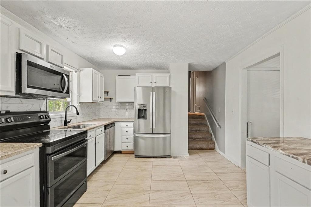 3 bedroom, 2 bathroom, 1,900 sq ft single family residence for sale at 6184 Marilla Street, Douglasville, GA 30135 — photo 4