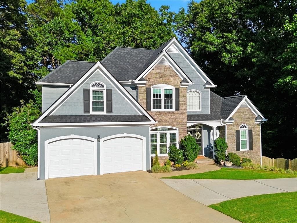 6 bedroom, 4 bathroom, 3,440 sq ft single family residence for sale at 406 Lovinggood Landing Drive, Woodstock, GA 30189