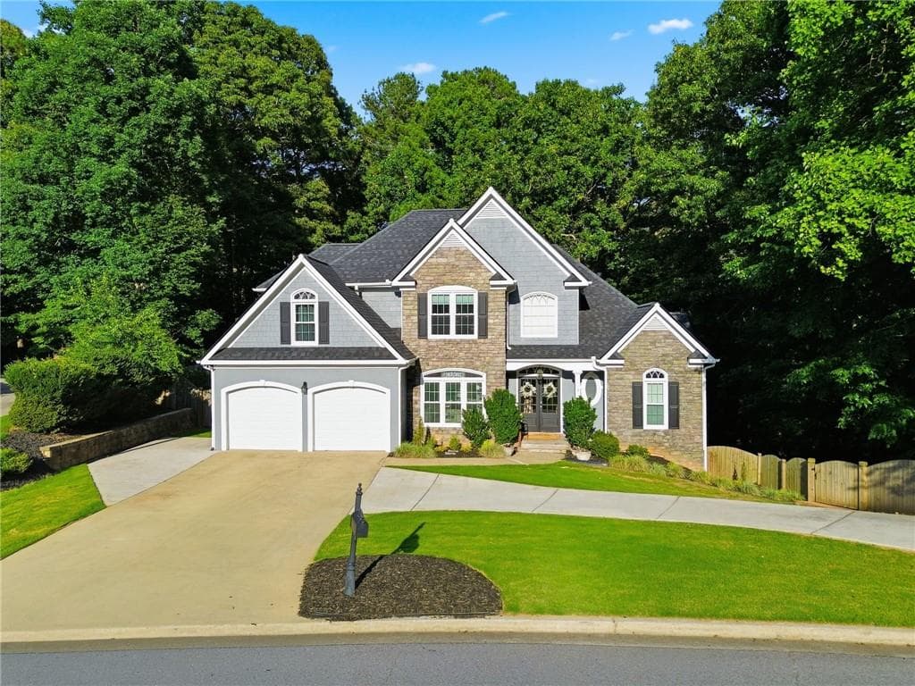 6 bedroom, 4 bathroom, 3,440 sq ft single family residence for sale at 406 Lovinggood Landing Drive, Woodstock, GA 30189 — photo 2