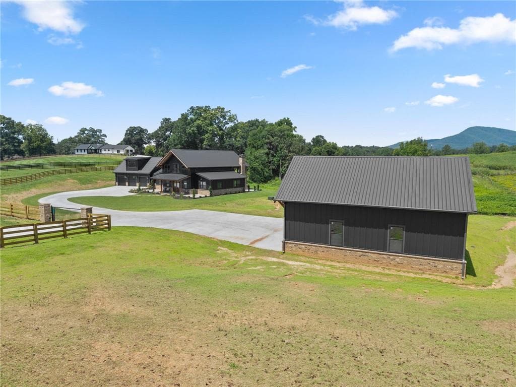 4 bedroom, 4 bathroom, 3,863 sq ft single family residence for sale at 5711 Cleveland Highway, Clermont, GA 30527 — photo 2