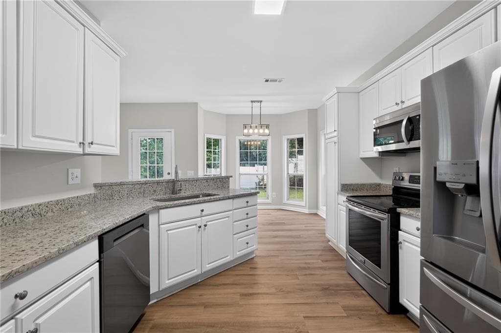 4 bedroom, 3 bathroom, 2,776 sq ft single family residence for sale at 2675 Factor Walk, Suwanee, GA 30024 — photo 9