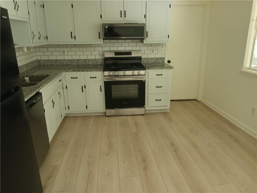 3 bedroom, 2 bathroom, 1,272 sq ft single family residence for sale at 1063 Salisbury Trail, Riverdale, GA 30296 — photo 4