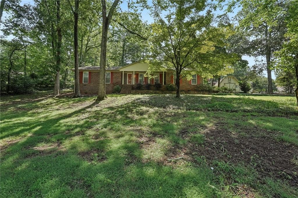 3 bedroom, 2 bathroom, 1,450 sq ft single family residence for sale at 1025 Greenwood Acres Drive, Cumming, GA 30040