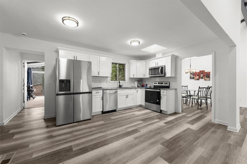 5 bedroom, 4 bathroom, 1,835 sq ft single family residence for sale at 3145 Flat Shoals Road, Atlanta, GA 30349 — photo 4