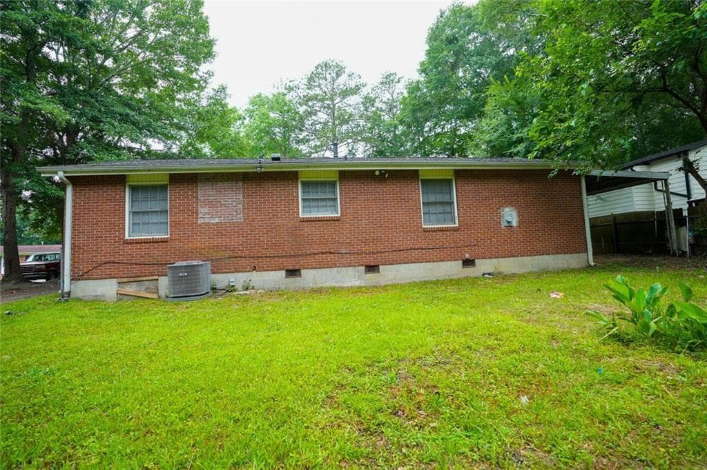 3 bedroom, 1 bathroom, 962 sq ft single family residence for sale at 7598 Connell Drive, Jonesboro, GA 30236 — photo 4