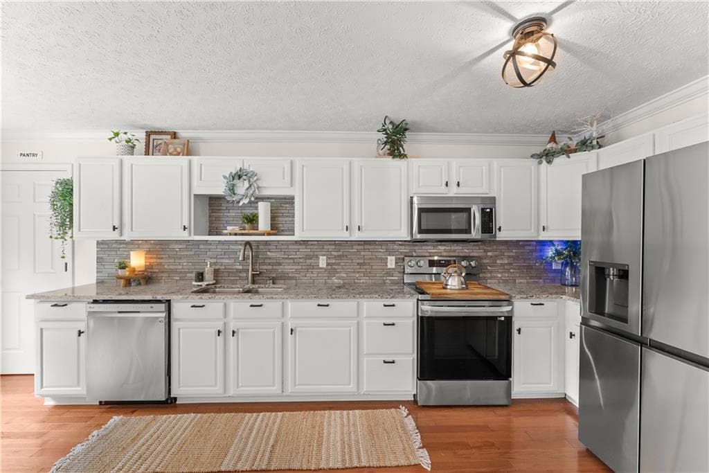 4 bedroom, 3 bathroom, 1,629 sq ft single family residence for sale at 3448 Point View Circle, Gainesville, GA 30506 — photo 4