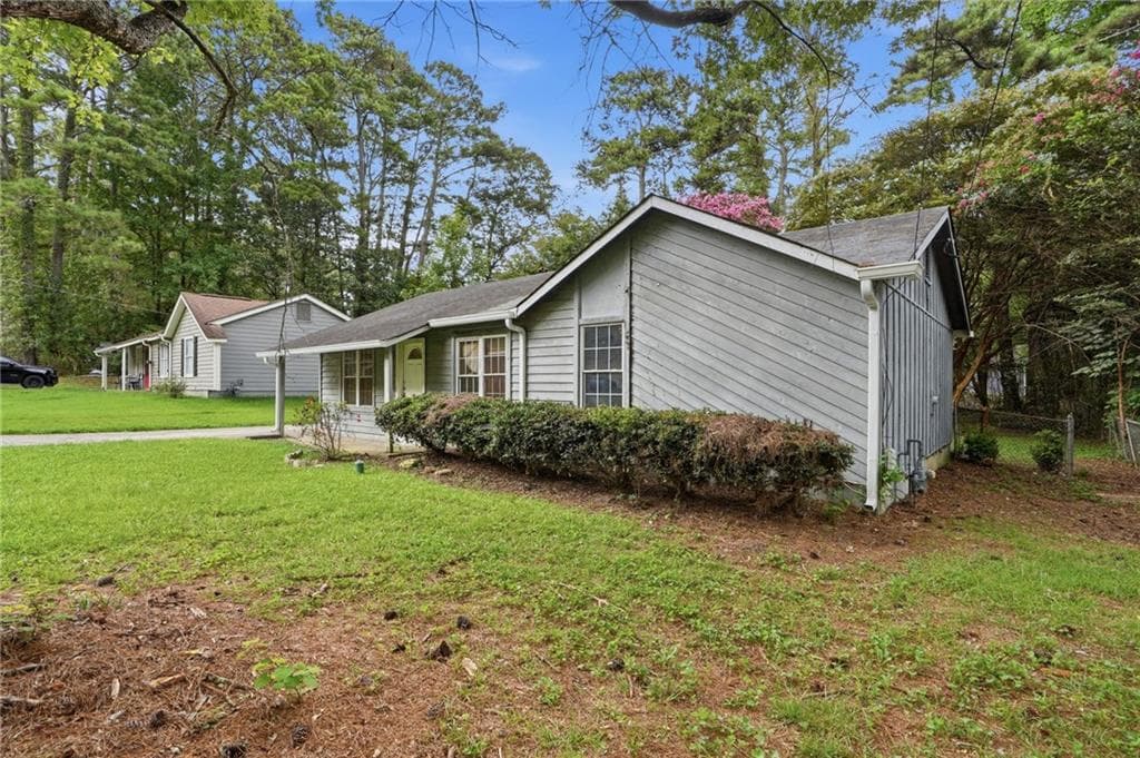 3 bedroom, 2 bathroom, 1,028 sq ft single family residence under contract at 8971 Ashwood Drive, Riverdale, GA 30274 — photo 2