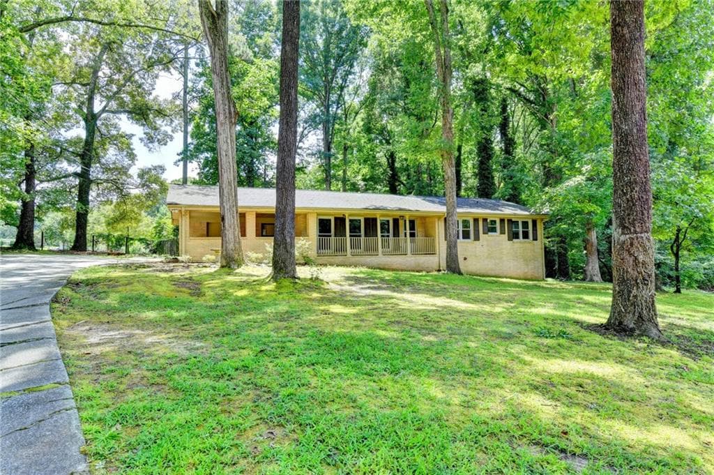 3 bedroom, 2 bathroom, 1,556 sq ft single family residence for sale at 1138 Woodland Circle, Lawrenceville, GA 30043