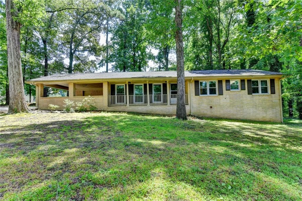 3 bedroom, 2 bathroom, 1,556 sq ft single family residence for sale at 1138 Woodland Circle, Lawrenceville, GA 30043 — photo 2