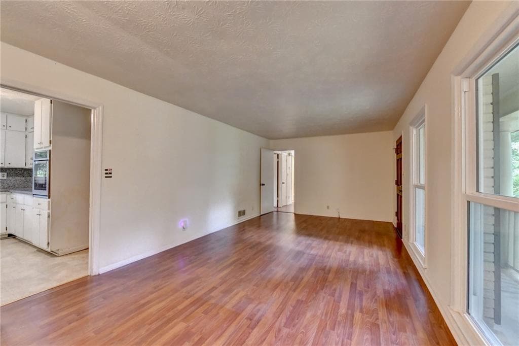 3 bedroom, 2 bathroom, 1,556 sq ft single family residence for sale at 1138 Woodland Circle, Lawrenceville, GA 30043 — photo 4