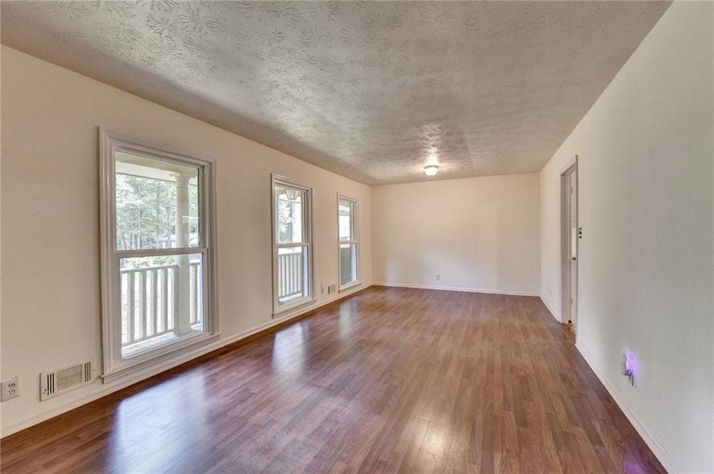 3 bedroom, 2 bathroom, 1,556 sq ft single family residence for sale at 1138 Woodland Circle, Lawrenceville, GA 30043 — photo 5
