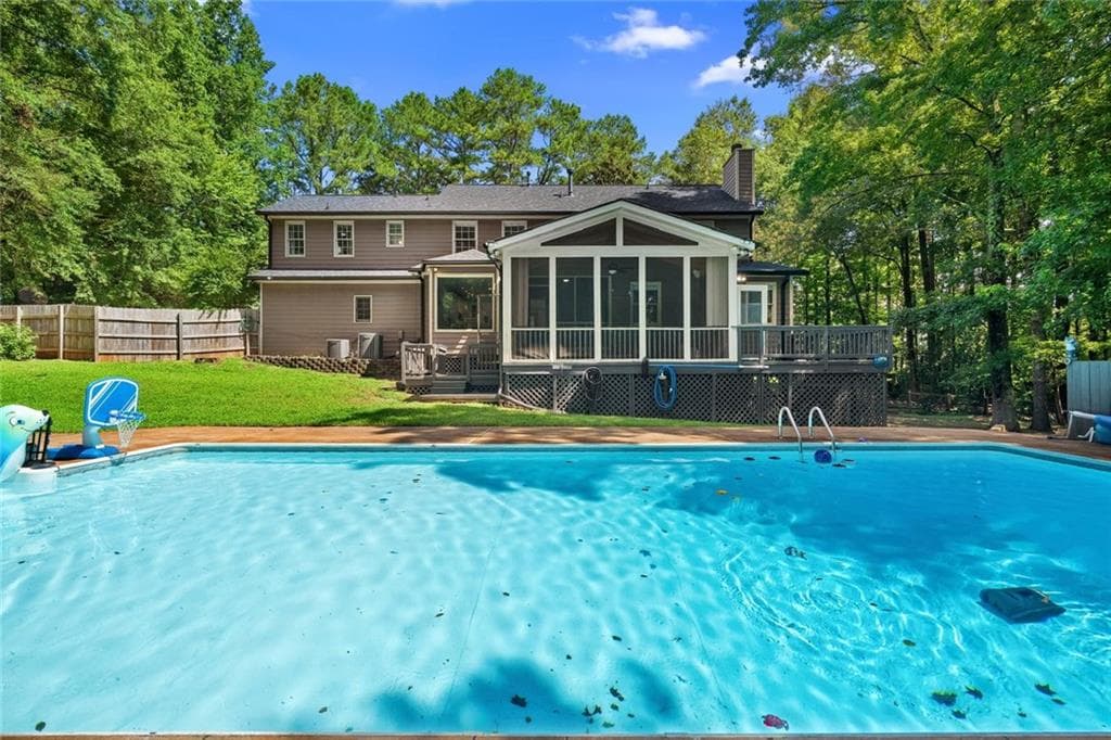 6 bedroom, 4 bathroom, 3,275 sq ft single family residence for sale at 10560 Haynes Bridge Road, Alpharetta, GA 30022 — photo 2