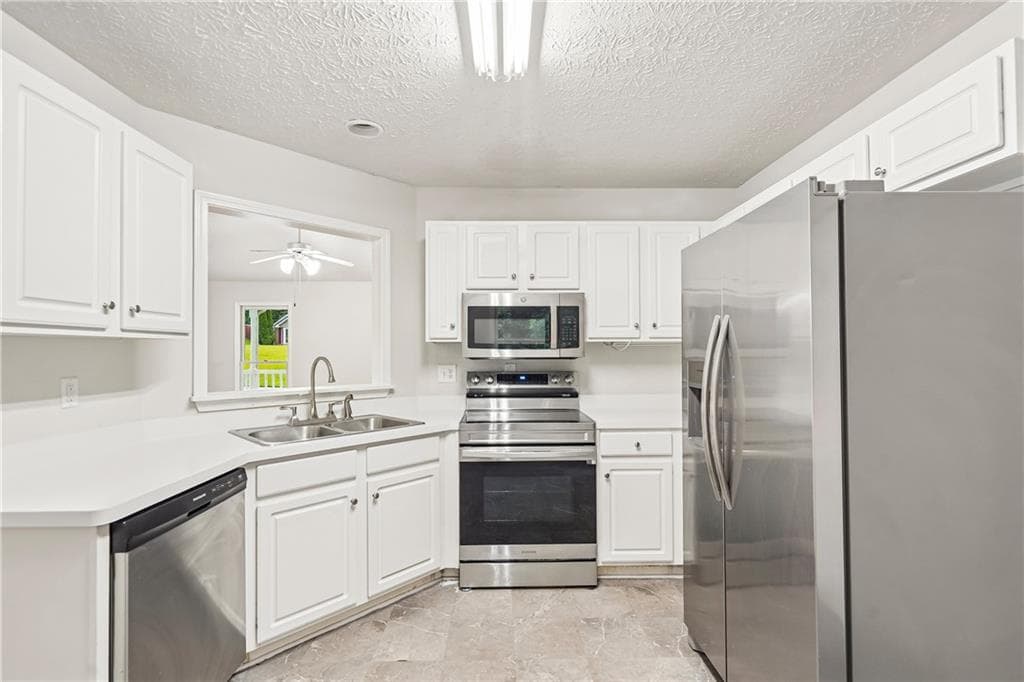4 bedroom, 2 bathroom, 2,459 sq ft single family residence for sale at 484 Legacy Park Drive, Powder Springs, GA 30127 — photo 3