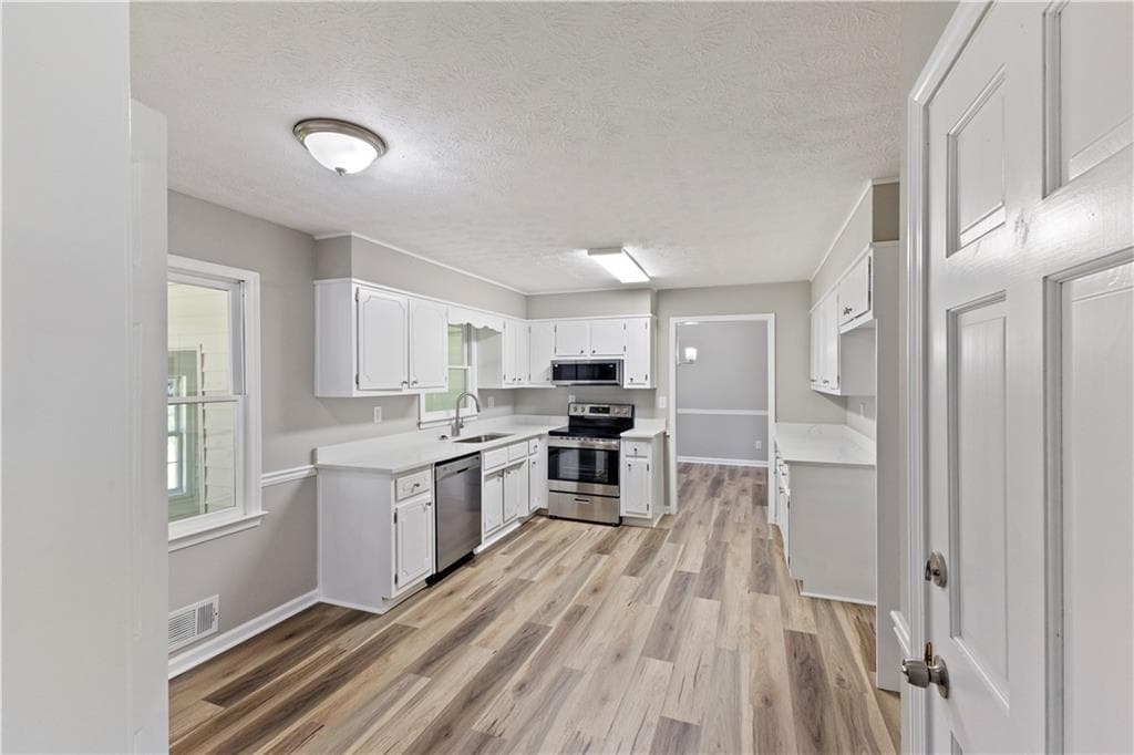 4 bedroom, 3 bathroom, 2,160 sq ft single family residence for sale at 91 Bentridge Court, Lawrenceville, GA 30043 — photo 2