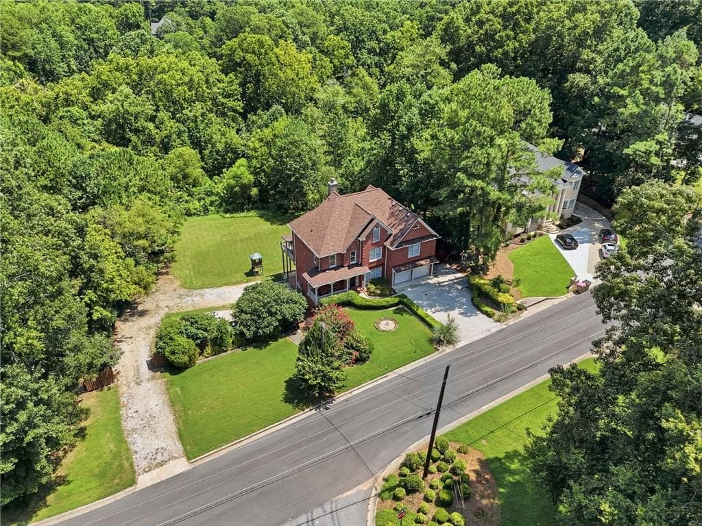 7 bedroom, 5 bathroom, 5,388 sq ft single family residence for sale at 1340 Eryn Circle, Suwanee, GA 30024 — photo 3
