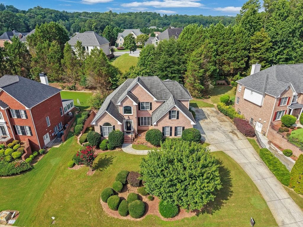 6 bedroom, 5 bathroom, 5,835 sq ft single family residence for sale at 2977 Cadbury Court, Snellville, GA 30039