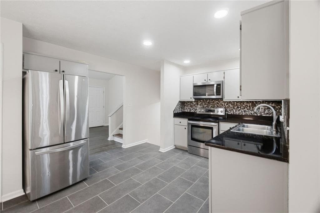 4 bedroom, 2 bathroom, 1,712 sq ft single family residence for sale at 1380 Ashbrook Drive, Lawrenceville, GA 30043 — photo 8