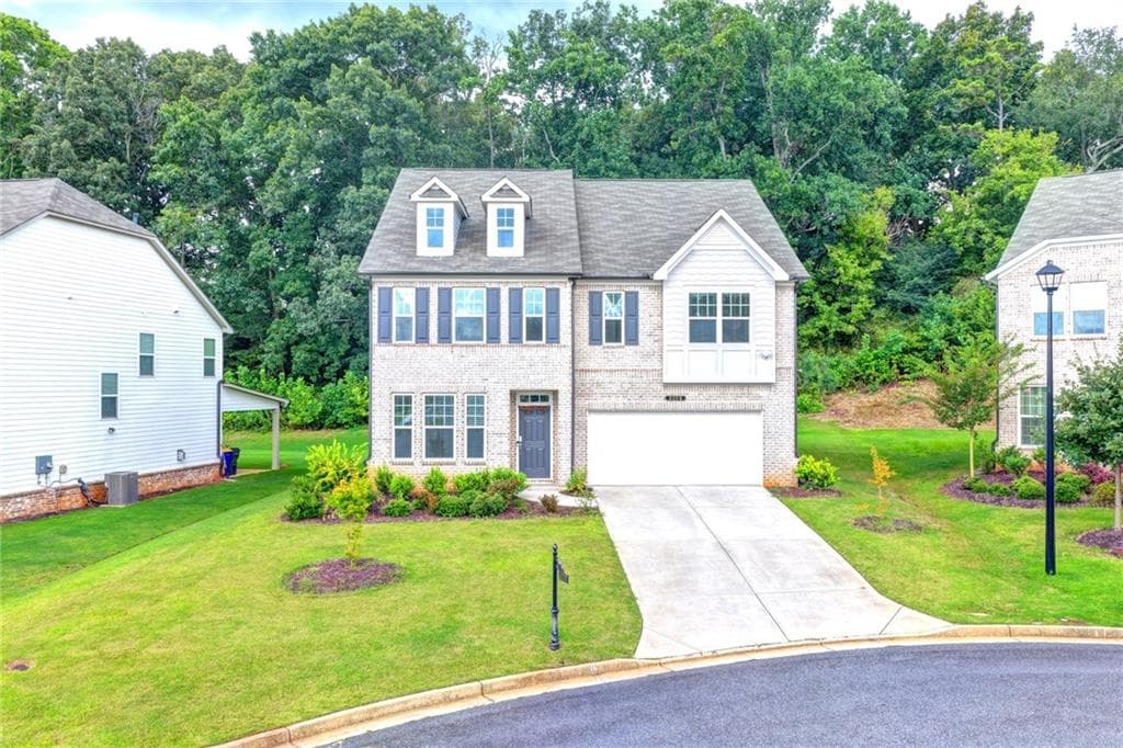 5 bedroom, 3 bathroom, 3,131 sq ft single family residence for sale at 5090 Bellehurst Lane, Cumming, GA 30040 — photo 2