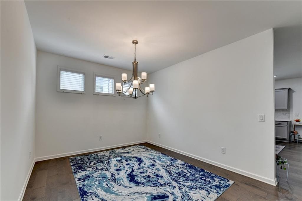 5 bedroom, 3 bathroom, 3,131 sq ft single family residence for sale at 5090 Bellehurst Lane, Cumming, GA 30040 — photo 4