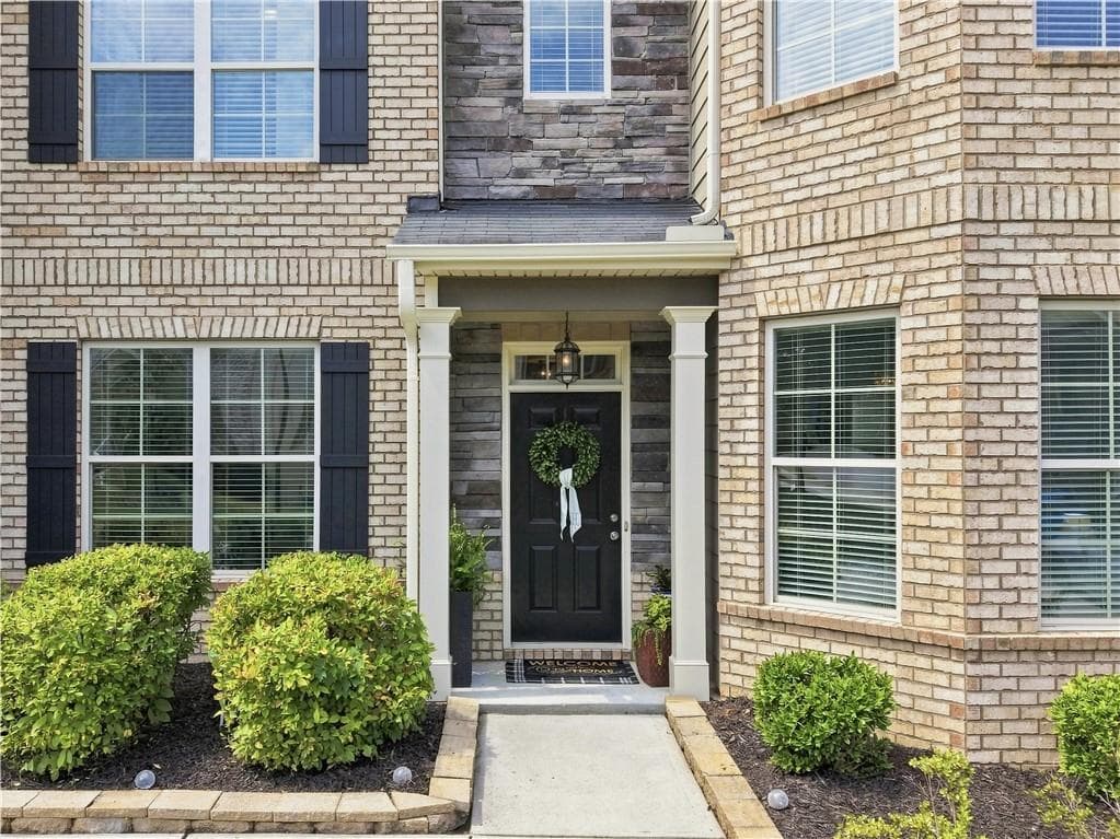 6 bedroom, 4 bathroom, 3,977 sq ft single family residence for sale at 2660 Ogden Trail, Buford, GA 30519 — photo 2