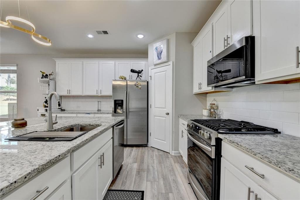 4 bedroom, 3 bathroom, 2,309 sq ft single family residence for sale at 3240 Herald Drive, Scottdale, GA 30079 — photo 8