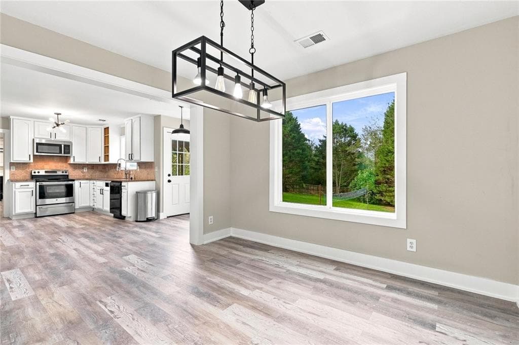 6 bedroom, 4 bathroom, 3,458 sq ft single family residence for sale at 1080 Big Haynes Drive, Grayson, GA 30017 — photo 4