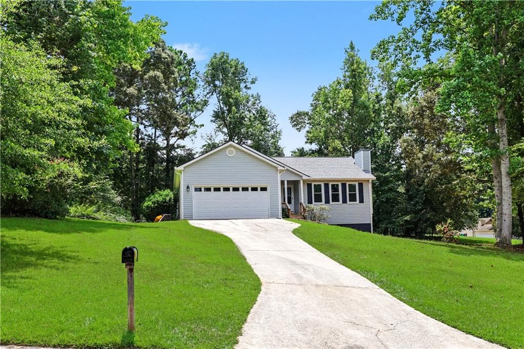 3 bedroom, 2 bathroom, 1,296 sq ft single family residence for sale at 1312 Smokerise Lane, Auburn, GA 30011 — photo 1 of 31
