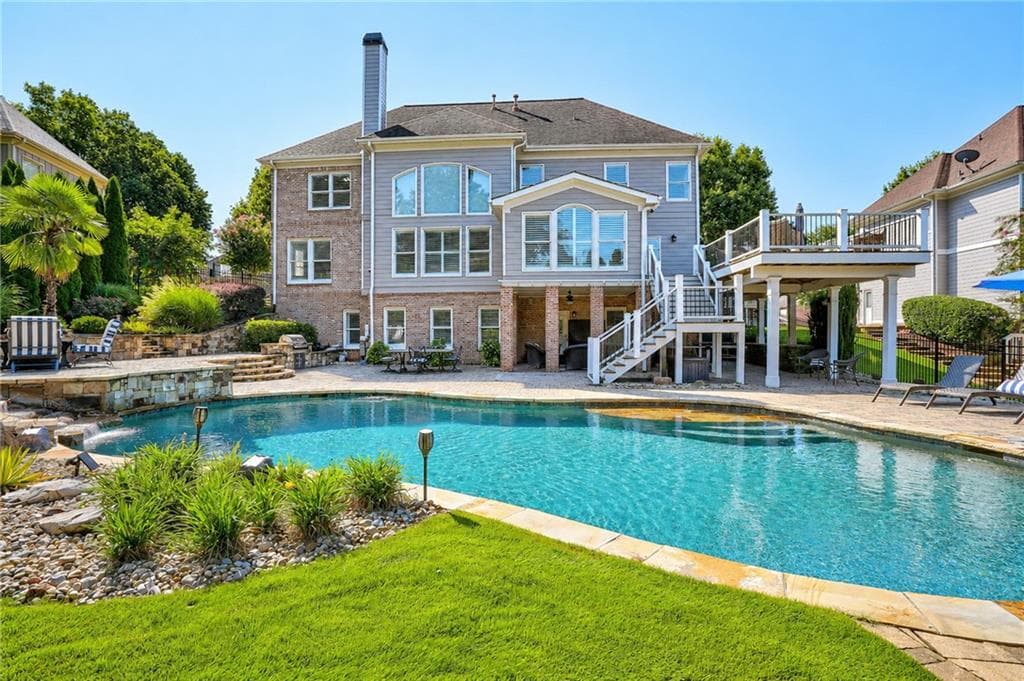 6 bedroom, 6 bathroom, 6,782 sq ft single family residence for sale at 1043 Meadow Club Court, Suwanee, GA 30024 — photo 2