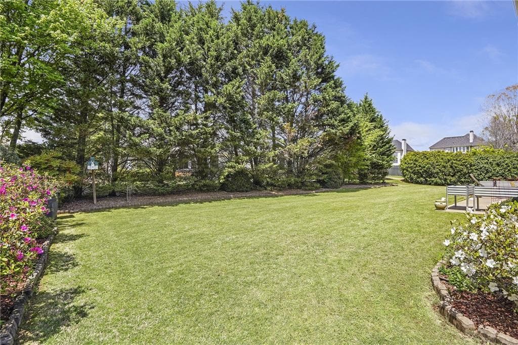 4 bedroom, 3 bathroom, 3,355 sq ft single family residence for sale at 7095 Grassmoor Grange Way, Cumming, GA 30040 — photo 2