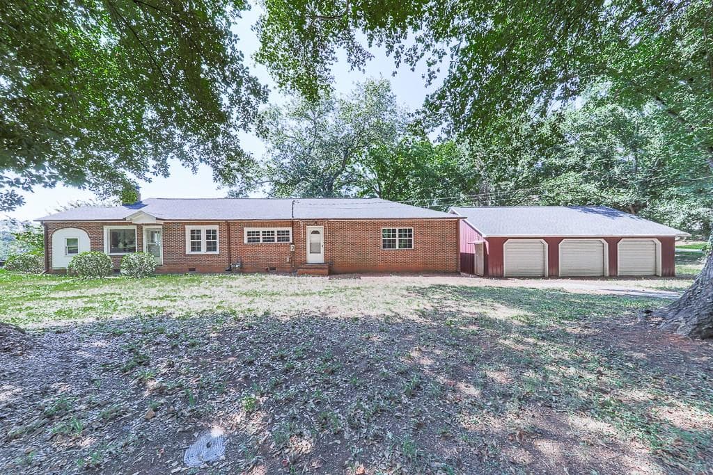 4 bedroom, 2 bathroom, 2,044 sq ft single family residence for sale at 514 Ball Ground Road, Ball Ground, GA 30107 — photo 1 of 45